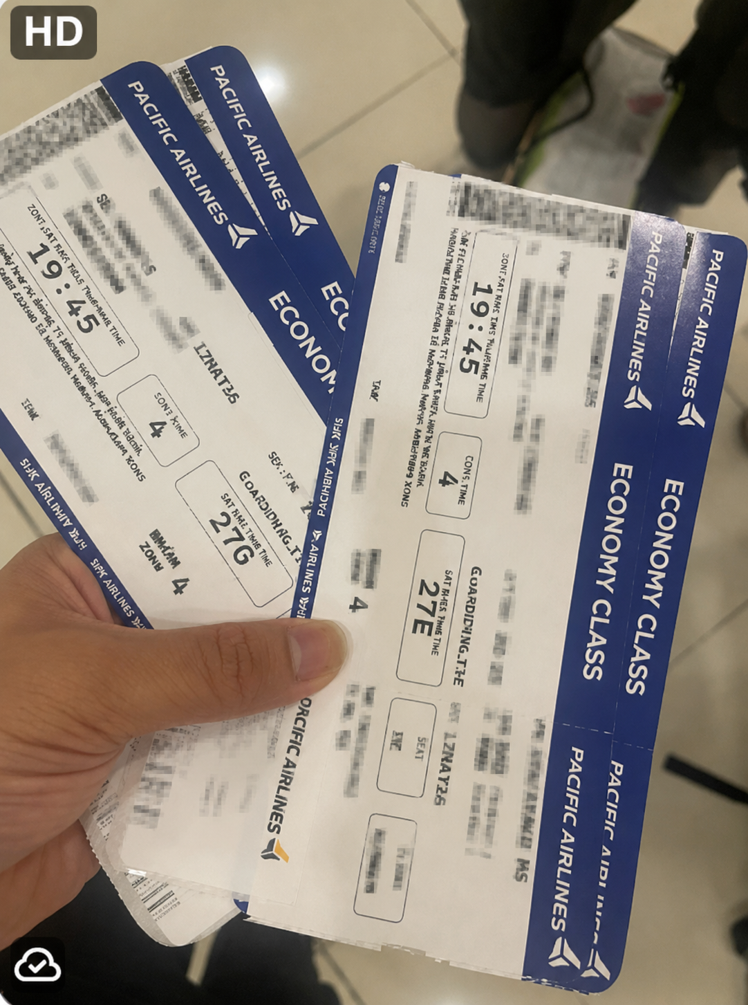 Boarding information checked during the family's international flight connection in Hanoi